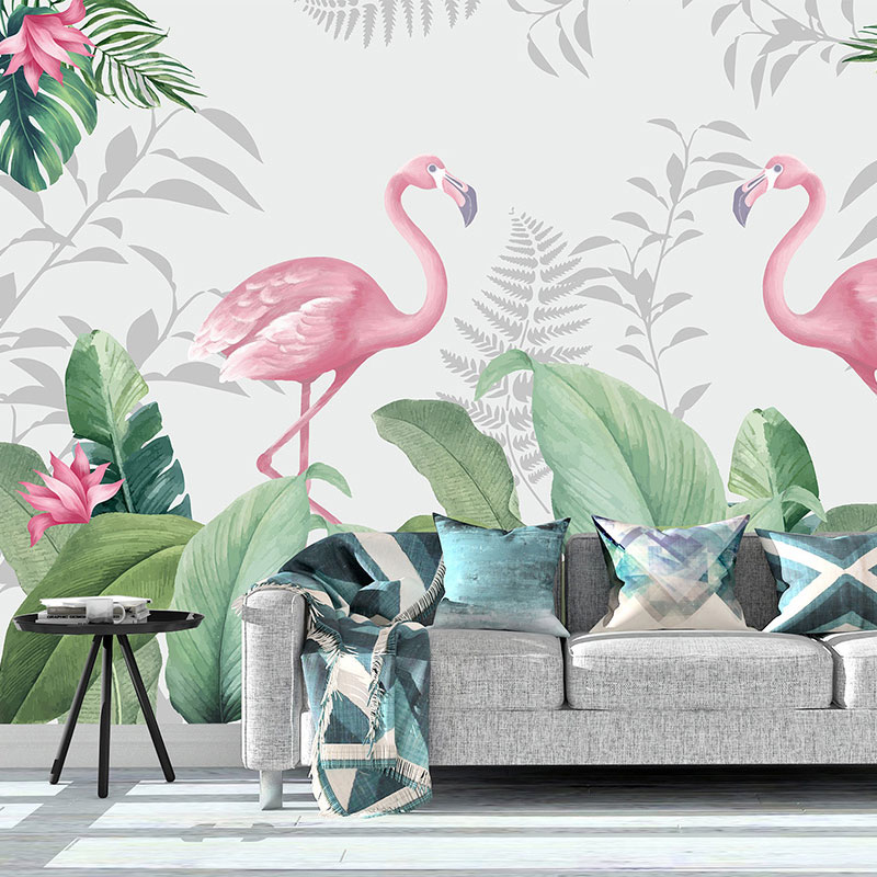 Foto tapeta Flamingosi među tropskim lišćem na zidu